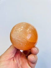 Load image into Gallery viewer, Orange Selenite Crystal sphere (6cm) SN030 x 1